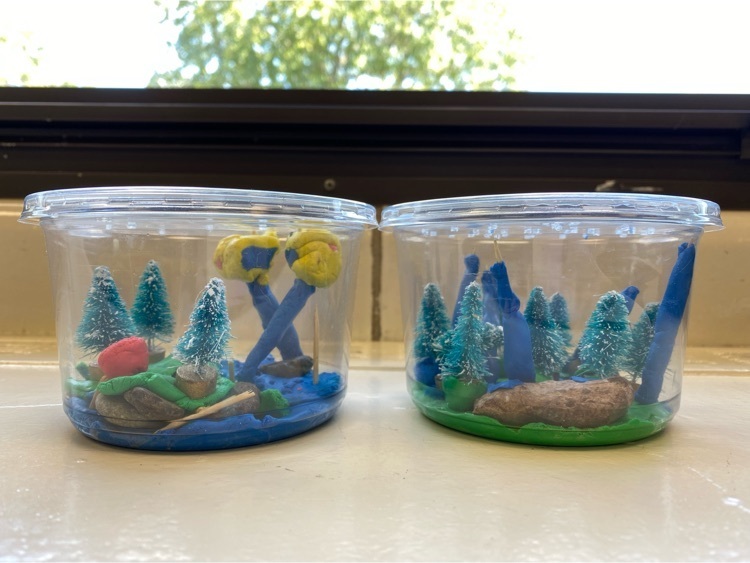 Models of the water cycle created using deli containers, modeling clay, toothpicks and rocks