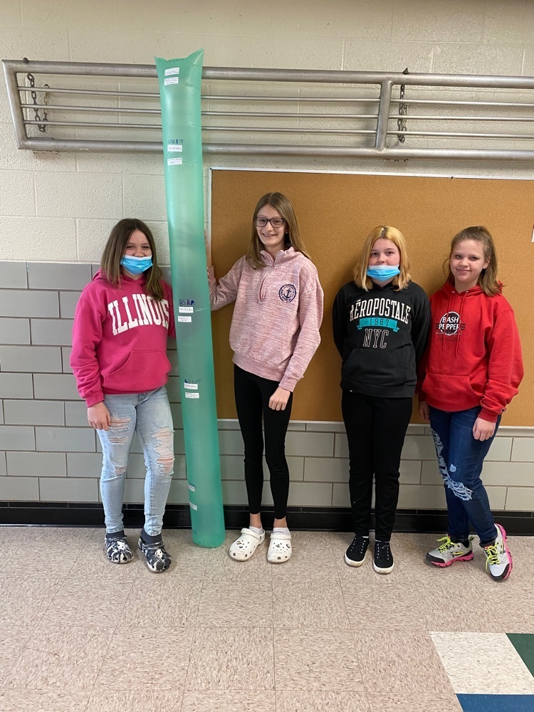group of students standing with their Bernoulli bag model of the atmosphere